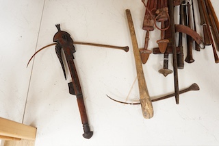 A quantity of African tribal spears swords and tools. Condition - varies